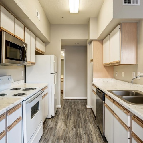 a kitchen with white cabinets